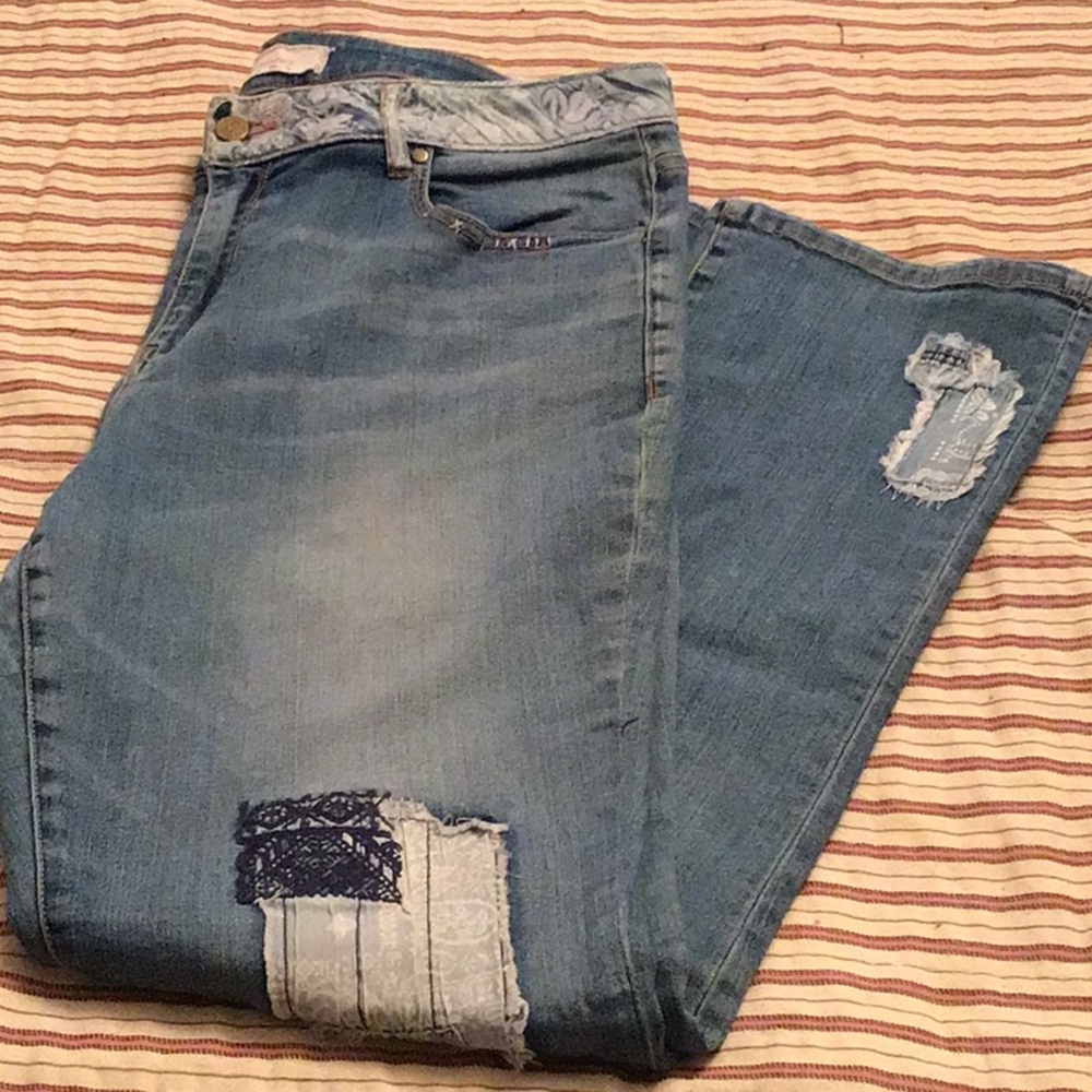 Sundance heavily distressed patched loved jeans.